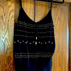 Sexy black tank with gold studs. Good condition.